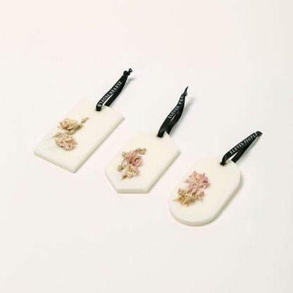 "Coffret de palets de cire parfumée – Poire, pivoine et patchouli"